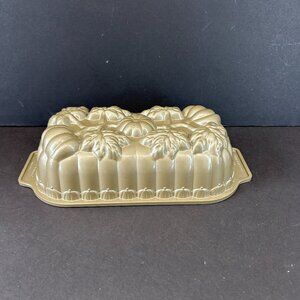 Nordic Ware Pumpkin Bread Loaf Pan featuring fall harvest pumpkins and leaves